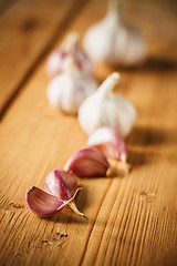 Image showing Raw garlic on wooden background