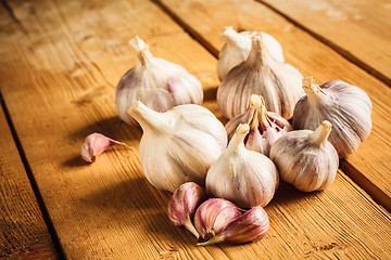 Image showing Raw garlic on wooden background