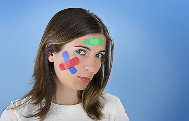 Image showing Woman with a cross bandages