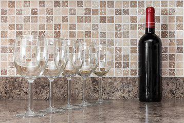 Image showing Bottle of wine and glasses on kitchen countertop