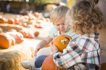 Image showing Young Family Enjoys a Day at the Pumpkin Patch