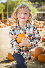 Image showing Little Boy Holding His Pumpkin at a Pumpkin Patch
