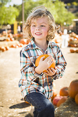 Image showing Little Boy Holding His Pumpkin at a Pumpkin Patch
