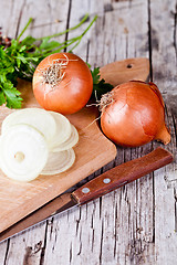 Image showing fresh onions, knife, and parsley