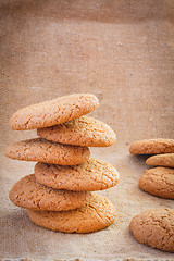 Image showing Stacked Brown Cookies On Rustic Background