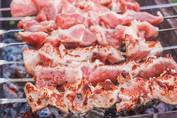 Image showing Shish Kebab In Process Of Cooking On Open Fire Outdoors