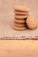 Image showing Stacked Brown Cookies On Rustic Background