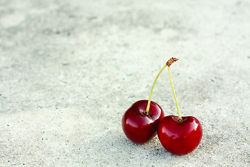 Image showing Two Cherries On Gray Background