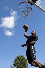 Image showing Man Dunking a Basketball