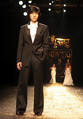 Image showing Asian fashion model on the catwalk during a fashion show - EDITO