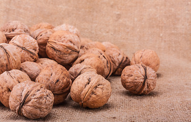 Image showing Walnuts Close-up On The Sackcloth Background 