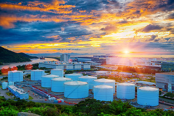 Image showing Oil tanks at sunset
