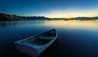 Image showing sunset on the lake, boat 