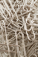 Image showing paper clips to background.