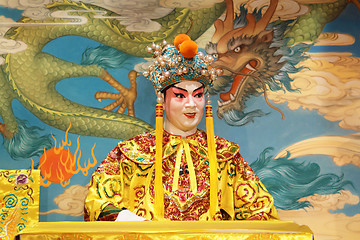 Image showing chinese opera dummy and red cloth as text space ,it is a toy,not