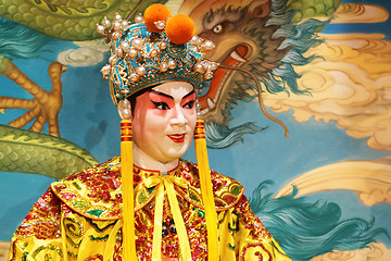 Image showing chinese opera dummy and red cloth as text space ,it is a toy,not