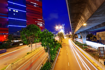 Image showing moving car with blur light through city at night 