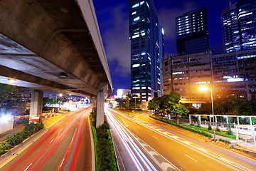 Image showing moving car with blur light through city at night 