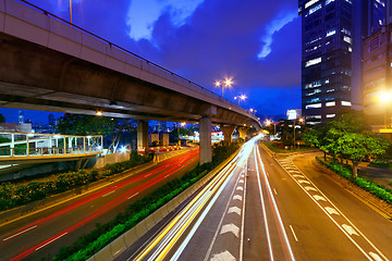 Image showing moving car with blur light through city at night 