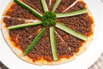 Image showing Turkish beef pizza with cucumber on top