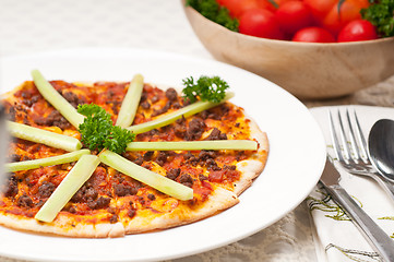 Image showing Turkish beef pizza with cucumber on top