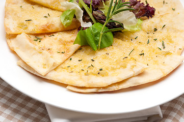 Image showing garlic pita bread pizza with salad on top