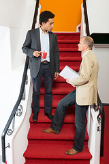 Image showing Businessmen Discussing On Steps