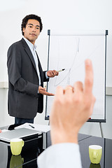 Image showing Businessman Explaining Graph With Colleague Raising Hand