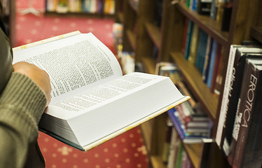 Image showing Open book in a bookstore