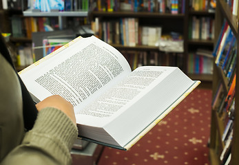 Image showing Open book in a bookstore