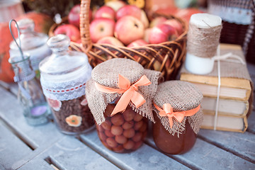 Image showing apples, jars, jams and books