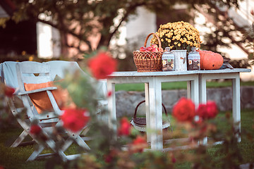 Image showing flowers, apples on table