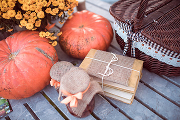 Image showing flowers, pumpkins, jams and books