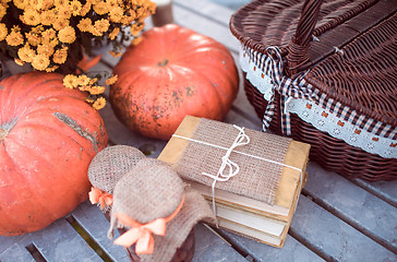 Image showing flowers, pumpkins, jams and books