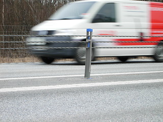 Image showing A van driving fast