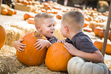 Image showing Two Boys at the Pumpkin Patch Talking and Having Fun
