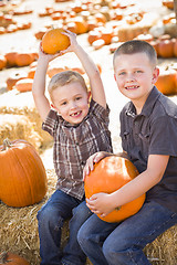 Image showing Two Boys at the Pumpkin Patch Talking and Having Fun
