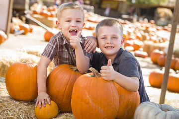 Image showing Two Boys at the Pumpkin Patch with Thumbs Up