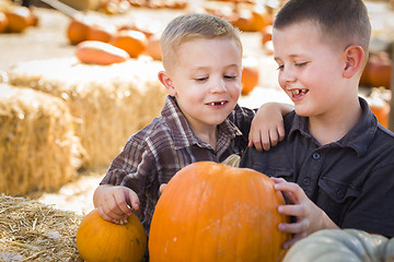 Image showing Two Boys at the Pumpkin Patch Talking and Having Fun
