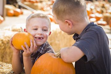 Image showing Two Boys at the Pumpkin Patch Talking and Having Fun
