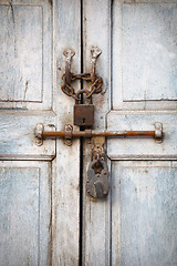 Image showing Two padlocks on the old door