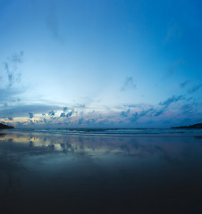 Image showing Evening on the beach - beautiful reflection of clouds