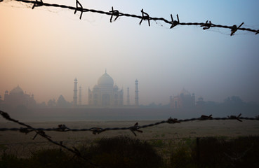 Image showing Taj Mahal from the riverside, trough barbed wire