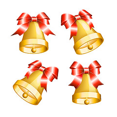 Image showing Set of golden bells with red bows.