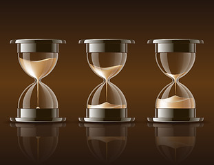 Image showing Sand falling in the hourglass.