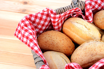 Image showing Fresh bread rolls in a rustic picnic basket