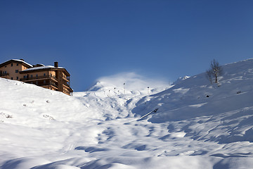 Image showing Off-piste slope and hotel in winter mountains