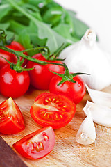 Image showing fresh tomatoes, rucola and garlic 