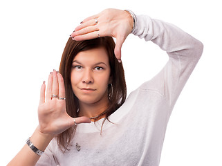 Image showing Pretty woman with frame gesture