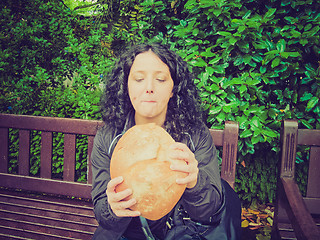 Image showing Girl eating bread